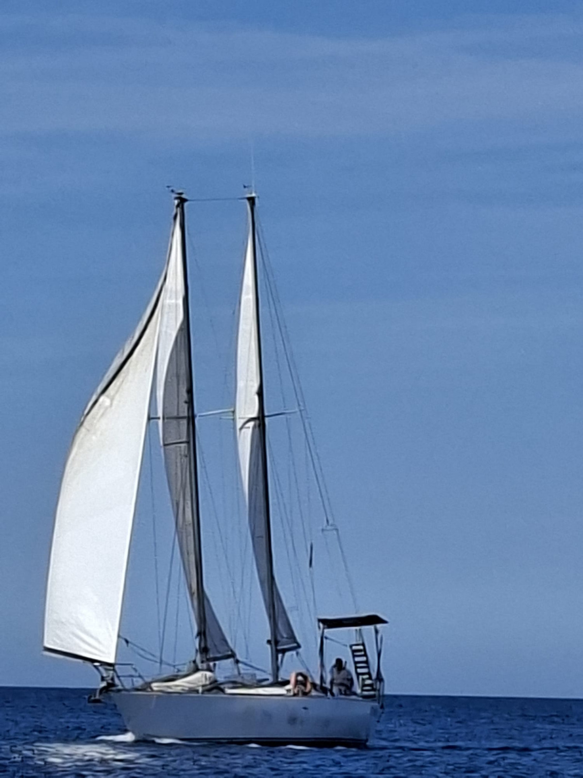 Elegant white sails of BIN BEL II gulet at sea in Salento